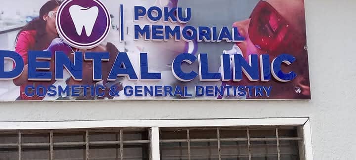 Poku Memorial Dental Clinic sign on the building