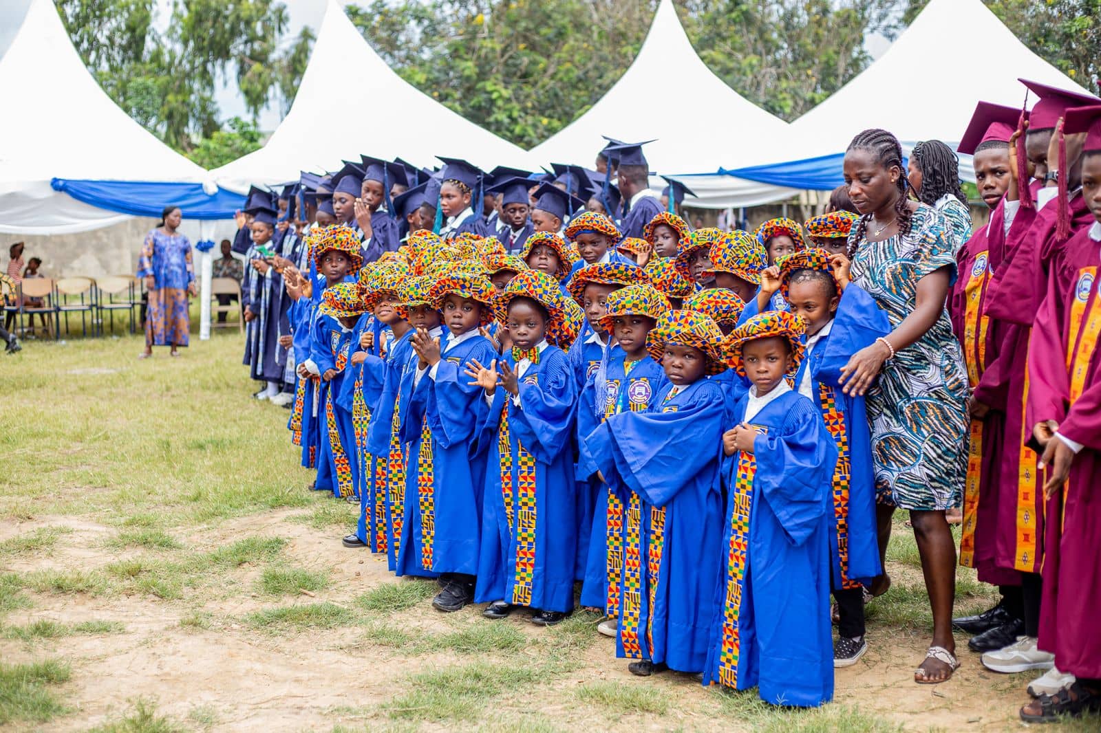 Ghanaian ceremony with graduates in gowns